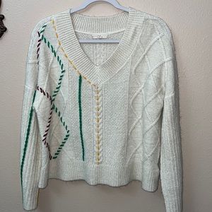 Cream sweater with yellow, green and maroon. Size M, in excellent condition.
